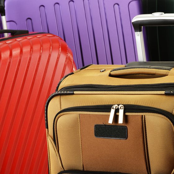Composition with colorful travel suitcases
